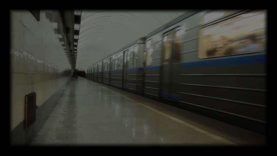 A Train Is Moving Down The Subway Wallpaper