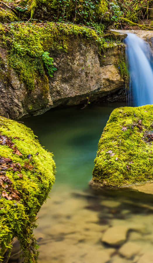 A Waterfall In The Woods Wallpaper