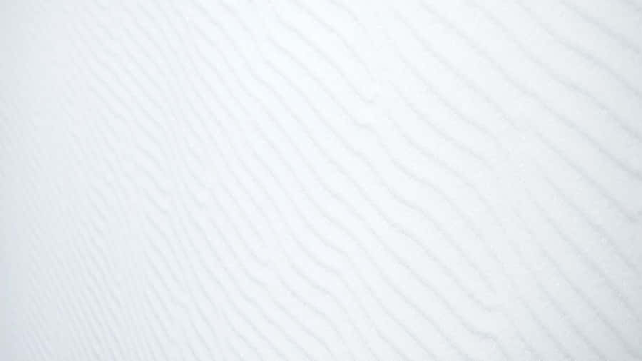 A White Wall With A Pattern Of Waves Wallpaper