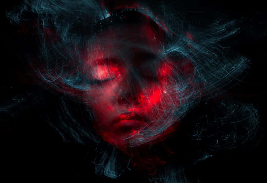 A Woman's Face With Red Light In The Background Wallpaper