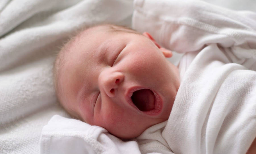 Adorable Newborn Baby Caught Mid-yawn Wallpaper