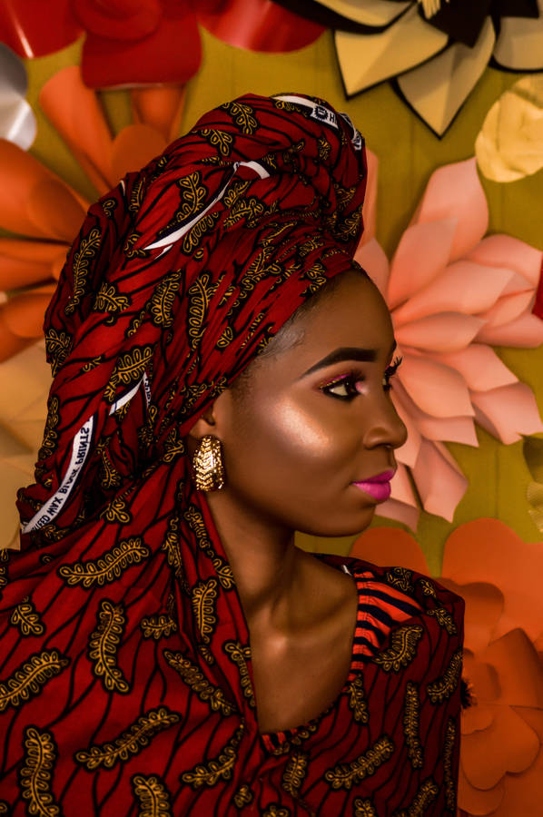 African Black Woman In Red Floral Headwrap Wallpaper