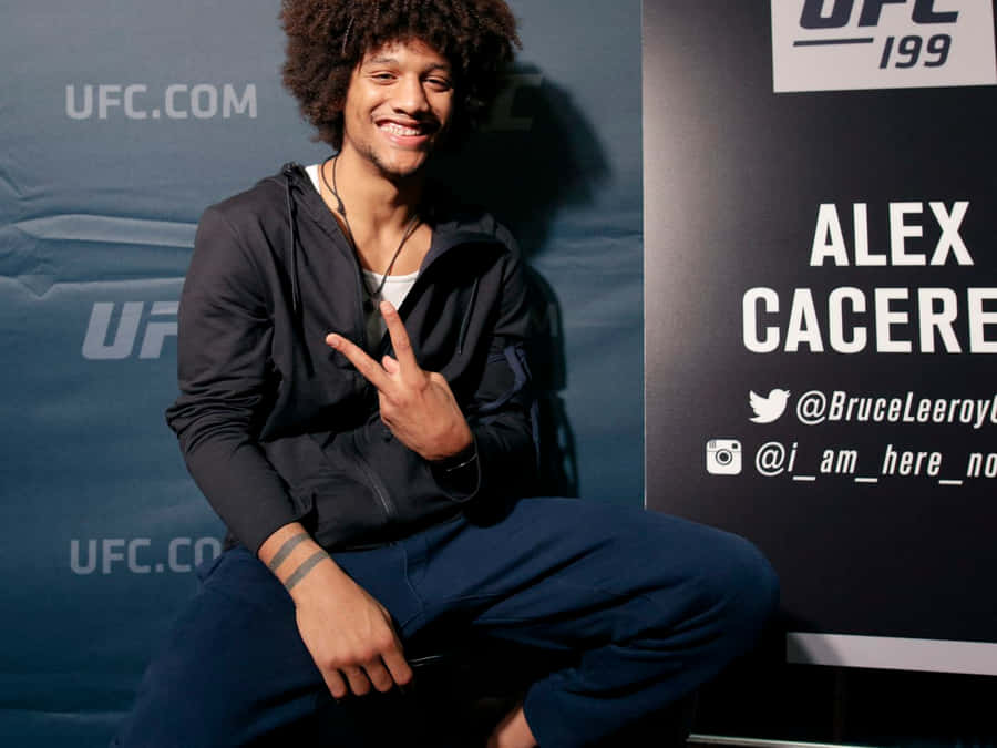 Alex Caceres Posing Peace Sign Wallpaper