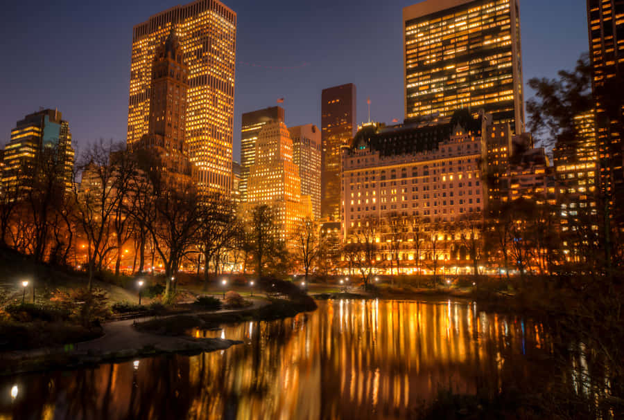 Amazing Night Skyline Of A Modern City. Wallpaper