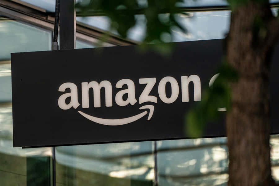 Amazon Uk Sign Near Tree Wallpaper