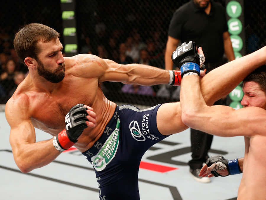 American Mixed Martial Arts Player Luke Rockhold Head Kick Photograph Wallpaper
