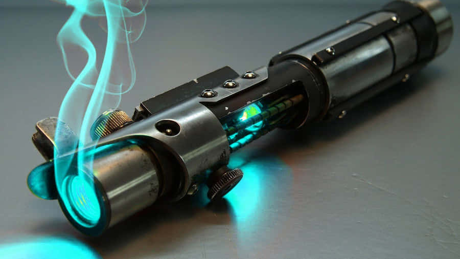 An Illuminated Star Wars Lightsaber Hanging Against A Backdrop Of Stars Wallpaper