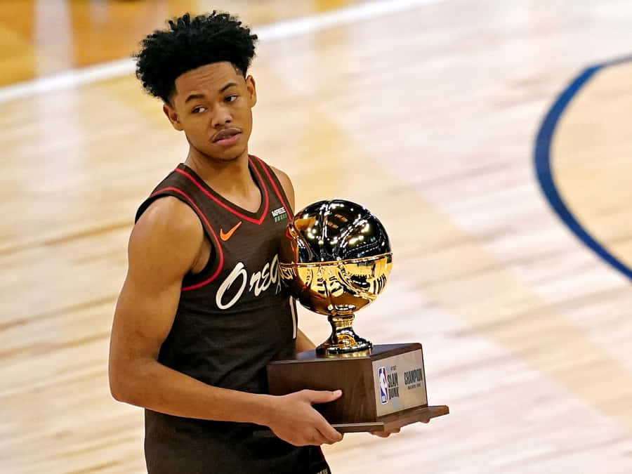 Anfernee Simons Holding Trophy Court Wallpaper
