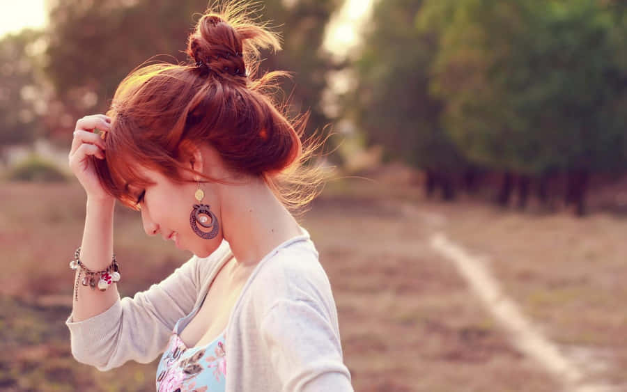 Asian Woman Profile With Messy Bun Wallpaper