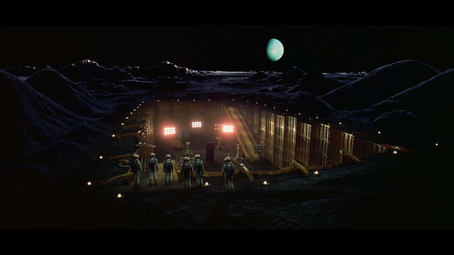 Astronauts From The Discovery One Spaceship Journey Through The Vast Reaches Of Unknown Space. Wallpaper