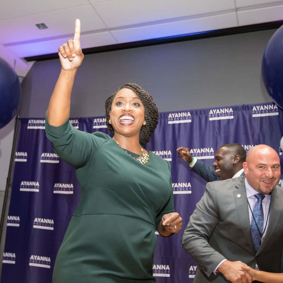 Ayanna Pressley Pointing Upwards Wallpaper