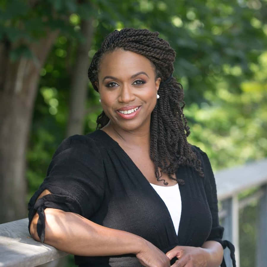 Ayanna Pressley Striking A Pose Outdoors. Wallpaper