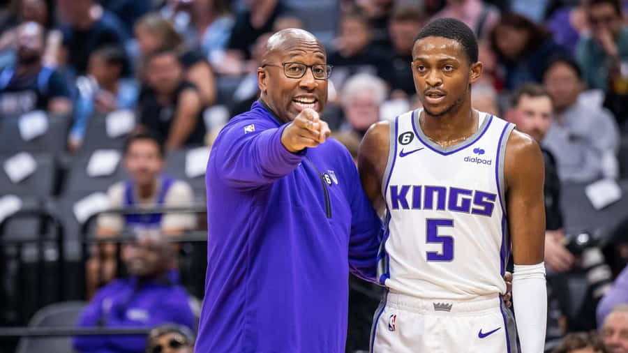 Basketball Coachand Player Discussion Wallpaper