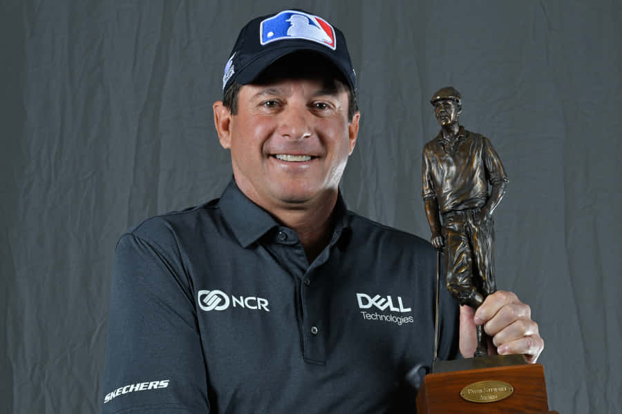 Billy Andrade Holding A Trophy Wallpaper