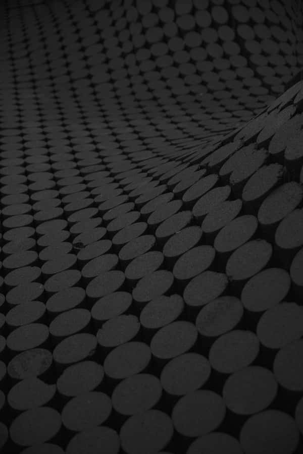 Black And Gray Carpet With A Circle Pattern Design Wallpaper