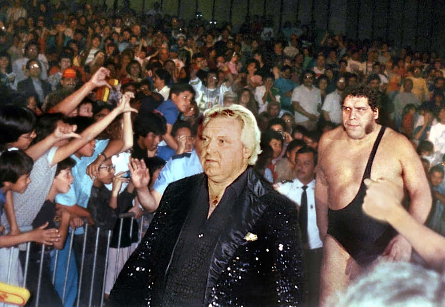 Bobby Heenanand Wrestler Walkingto Ring Wallpaper
