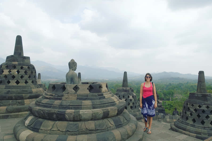 Borobudur Temple Woman Near Statue Wallpaper