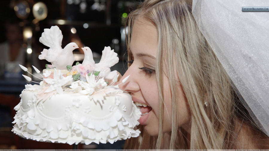 Bride Tasting White Wedding Cake Wallpaper