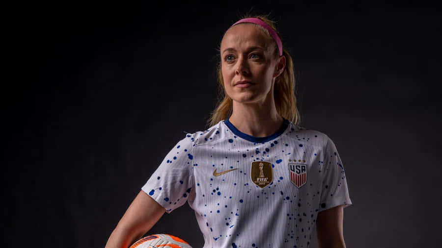 Caption: Strong And Fierce: Becky Sauerbrunn In Action Wallpaper