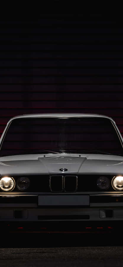 Caption: Vintage Elegance - Classic Car Iphone Wallpaper Wallpaper