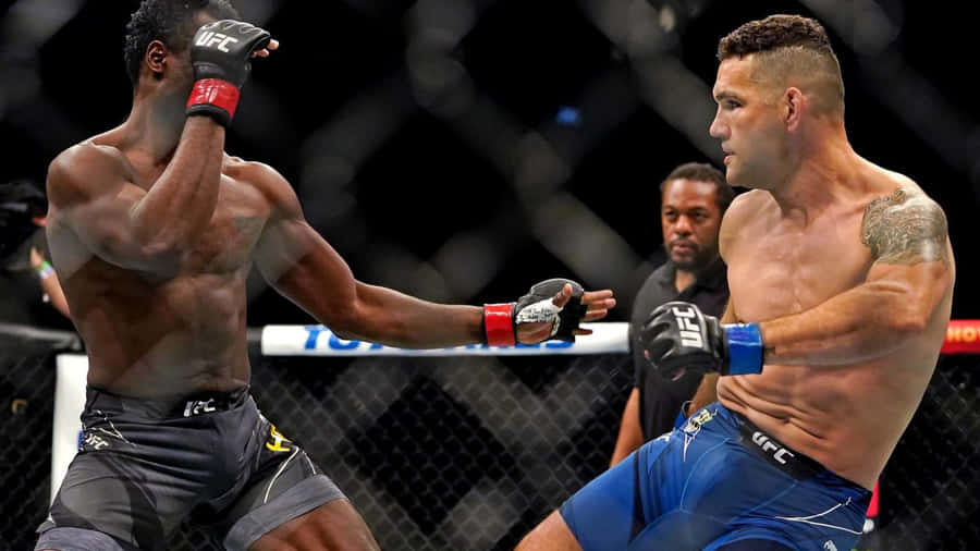 Chris Weidman Battles Uriah Hall In Ufc Match Wallpaper