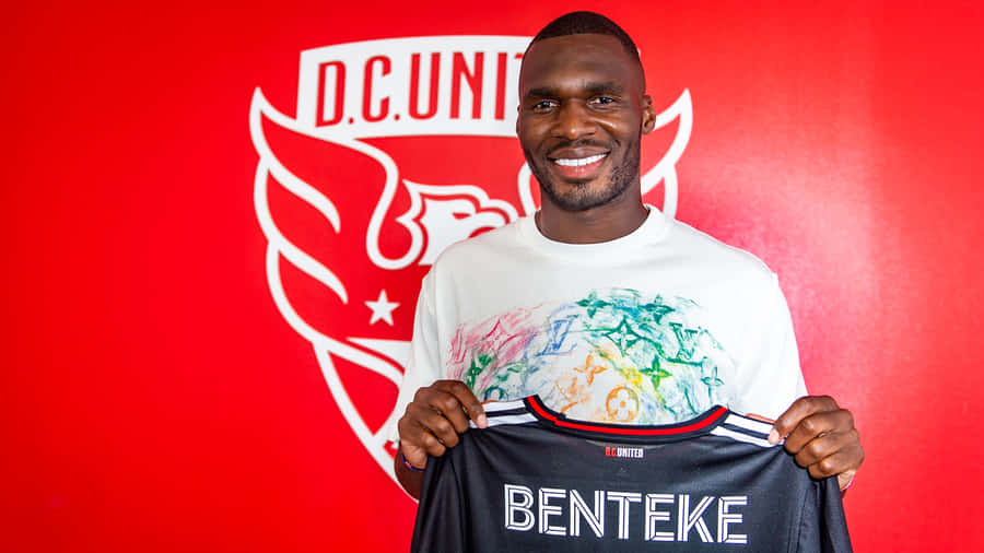 Christian Benteke Holding Black Jersey Wallpaper