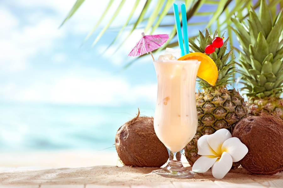 Coconut Milkshake On A Beach Wallpaper