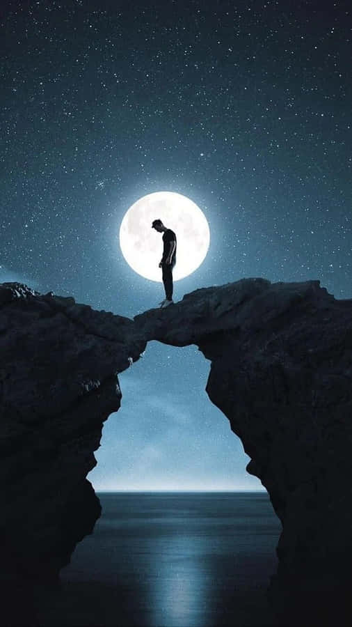 Contemplative Teen On The Edge Of A Cliff Wallpaper