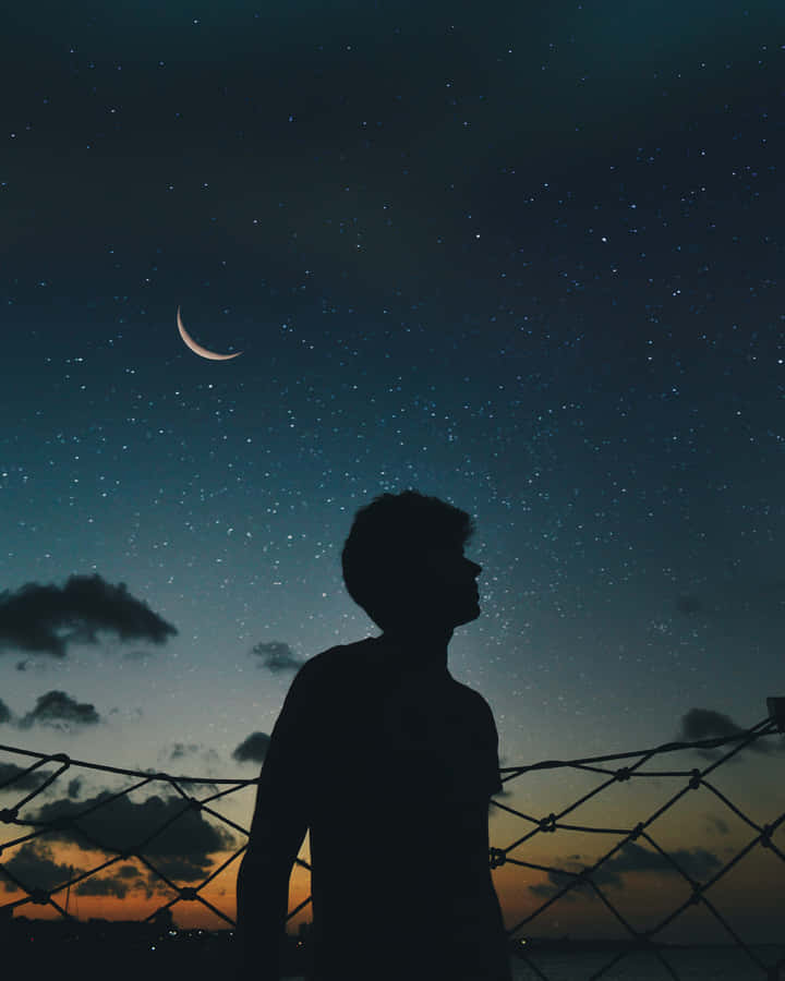Cool Sad Boy During Starry Night Wallpaper