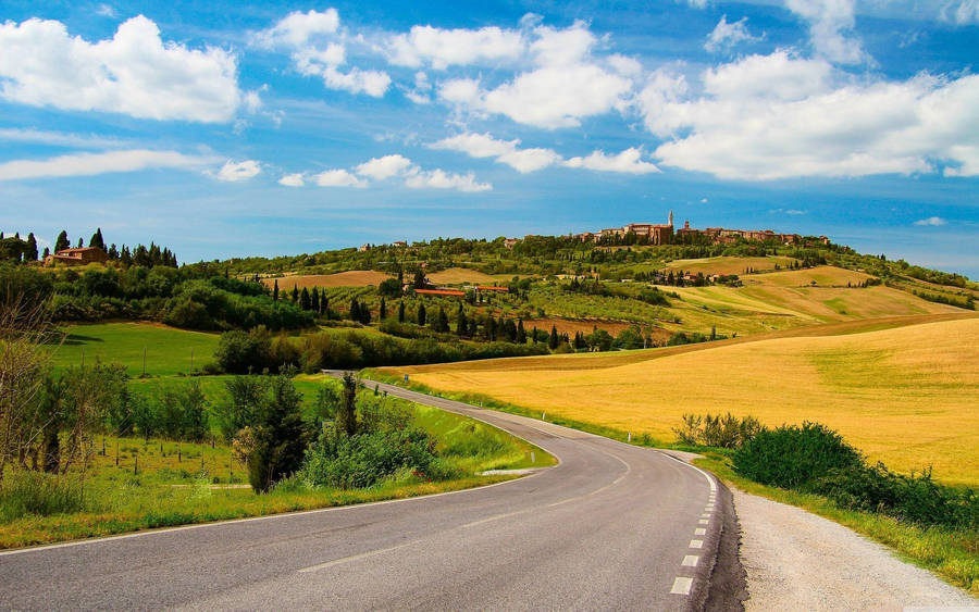 Country Road Hill Full Of Houses Wallpaper