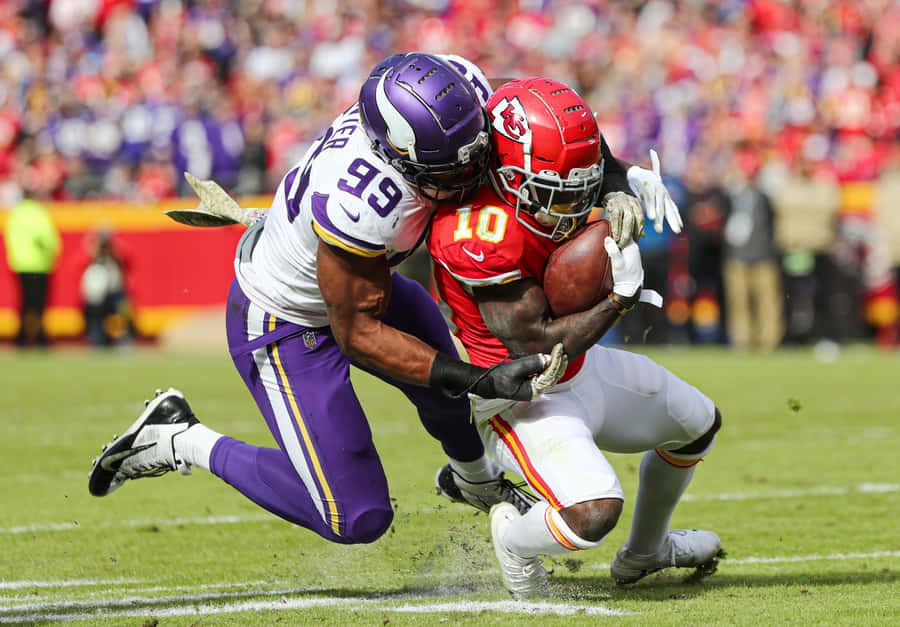 Danielle Hunter Tackling Tyreek Hill Wallpaper
