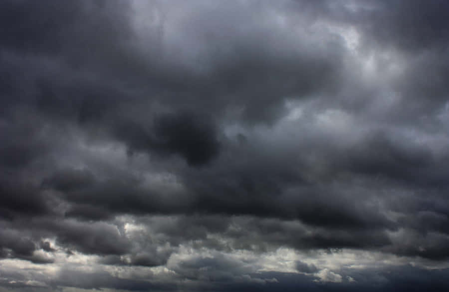 Dark And Light - A Contrasting View Of A Puffy Cloud Wallpaper