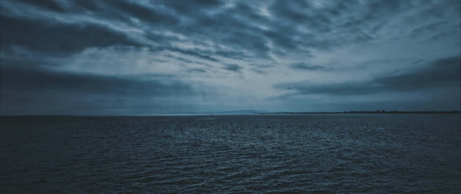 Dark Clouds Over Ocean4 K Wallpaper