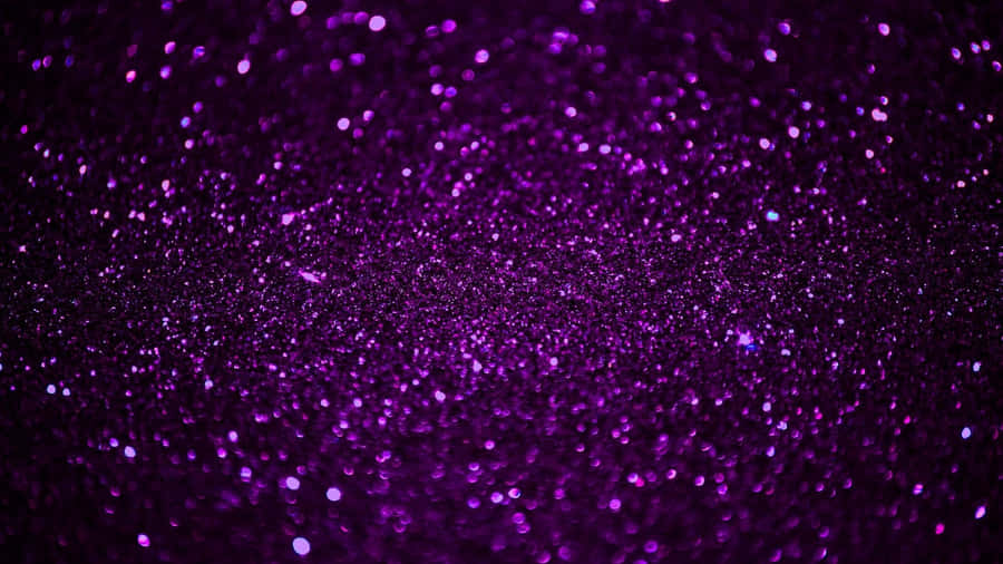 Enjoy A Dazzling Display Of Purple Glitter Wallpaper
