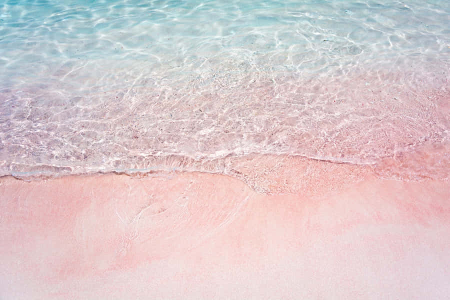 Enjoy The Calming Beauty Of A Pink Beach. Wallpaper