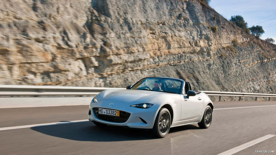 Enjoy The Wind-in-your-hair Freedom With Mazda Mx 5 Miata Wallpaper