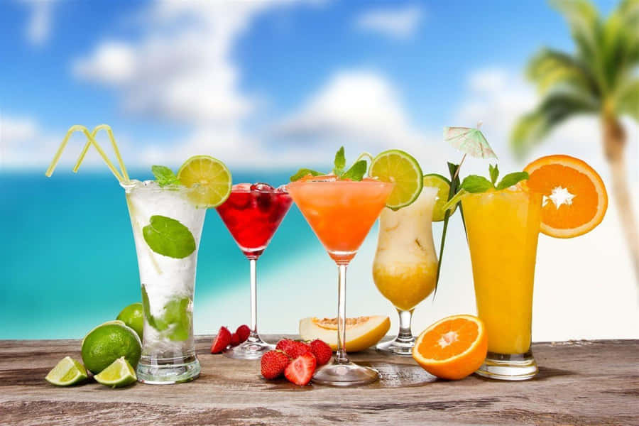 Exotic Juice Served In Fancy Cocktail Glasses Wallpaper