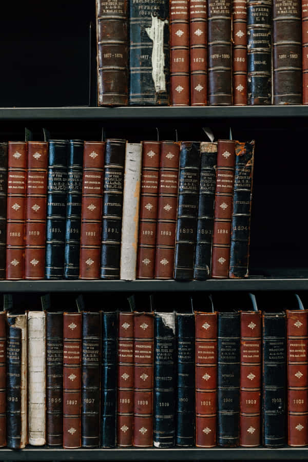 Experience The Thrill Of A Great Read On Your Iphone Wallpaper