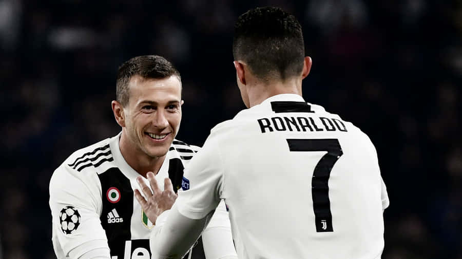 Federico Bernardeschi And Teammate Cristiano Ronaldo Wallpaper