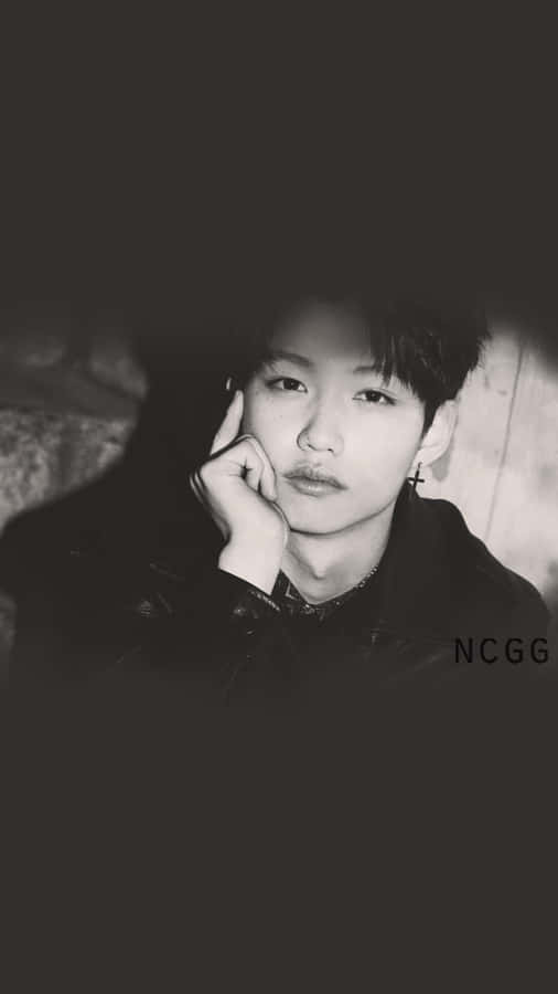 Felix Of Stray Kids Showing Off His Charismatic Charms Wallpaper