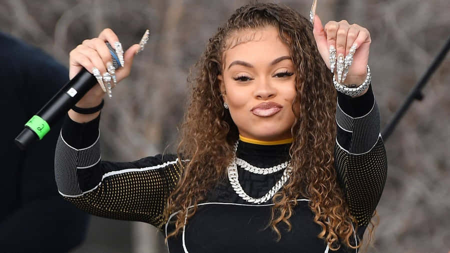 Female_ Artist_ Performing_ With_ Microphone Wallpaper