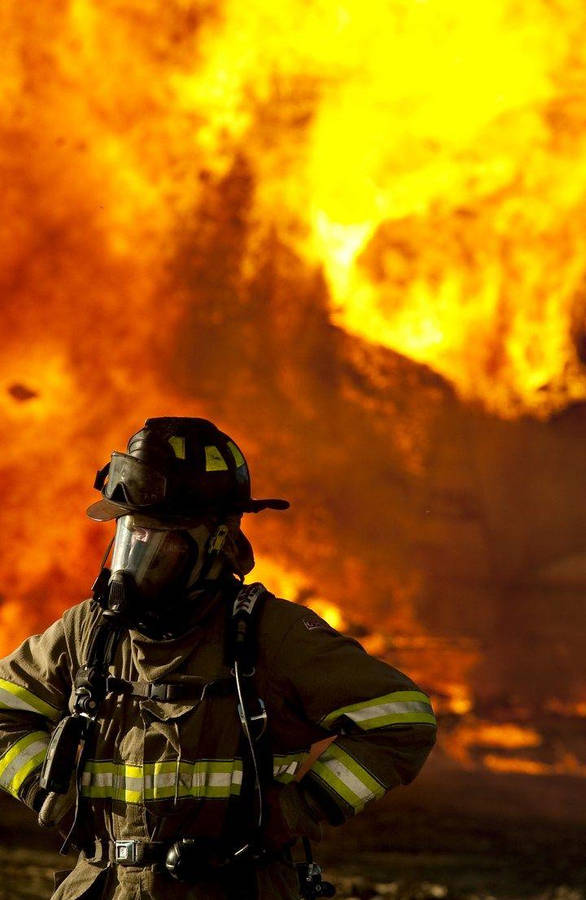 Firefighters In Front Of Fire Wallpaper