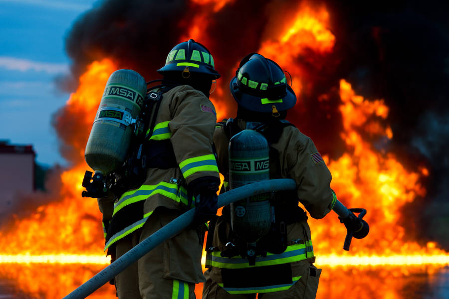 Firefighters Observing Large Fire Wallpaper