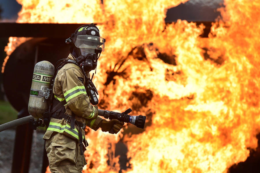 Firefighters On Duty With Hose Wallpaper