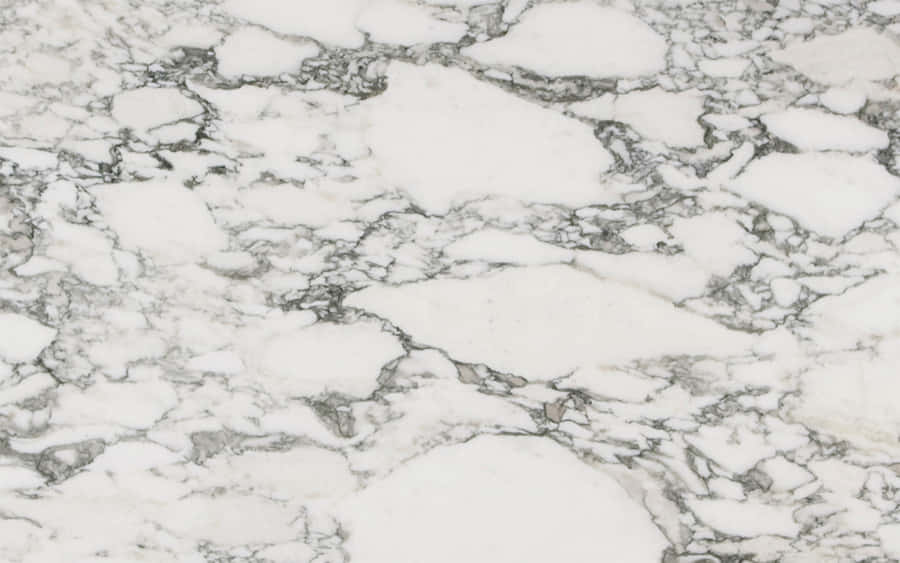 Get A Sleek And Stylish Look With This Timeless Marble Macbook Wallpaper