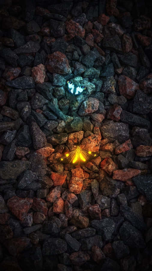 Glowing Elements Amidst Rocks Wallpaper