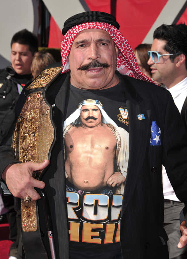 Iconic Wrestling Champion, The Iron Sheik Gazing Intensely+ Wallpaper