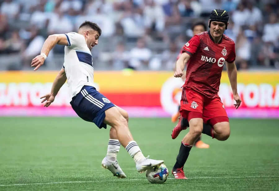 Intense Soccer Match Duel Wallpaper