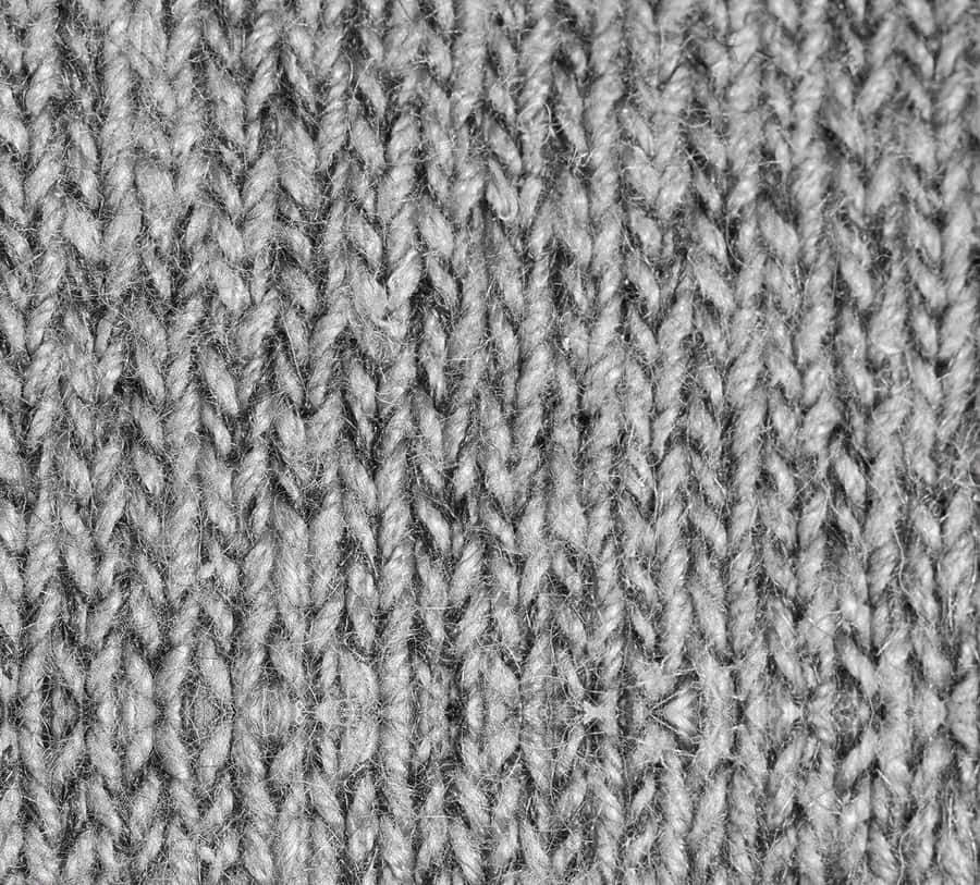 Intricate Weave Of A Gray Sweater Wallpaper