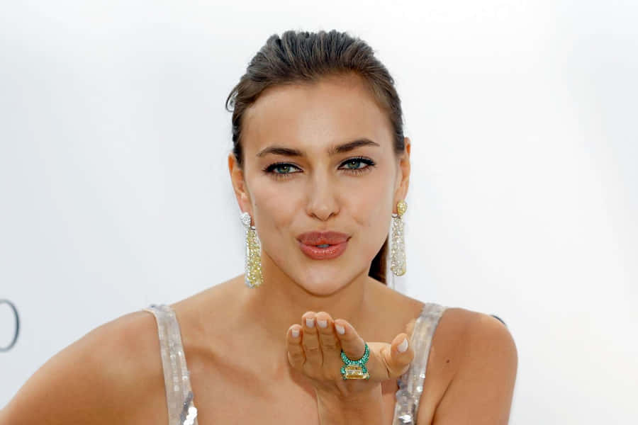 Irina Shayk, A Glamorous Icon Posing In Elegant Attire. Wallpaper